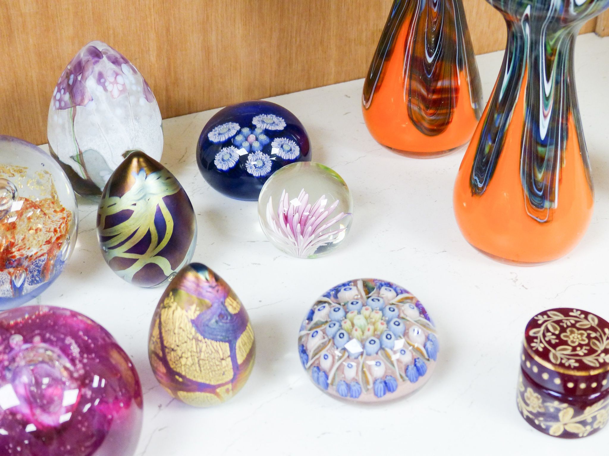 A group of 20th century glass paperweights and studio glass vases, Tallest 24 cm high